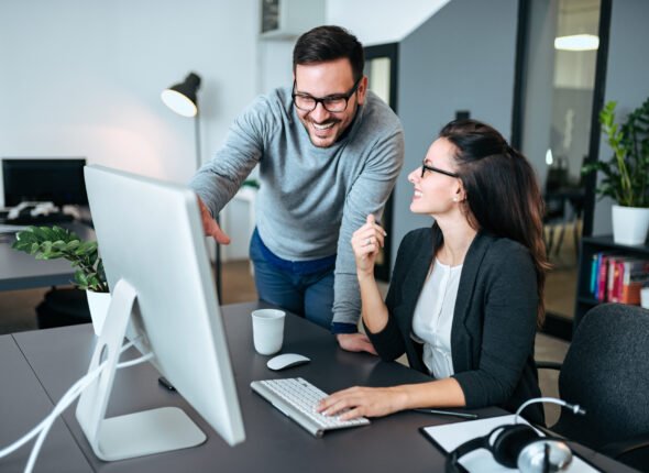 Two young business people meeting and discussing business.