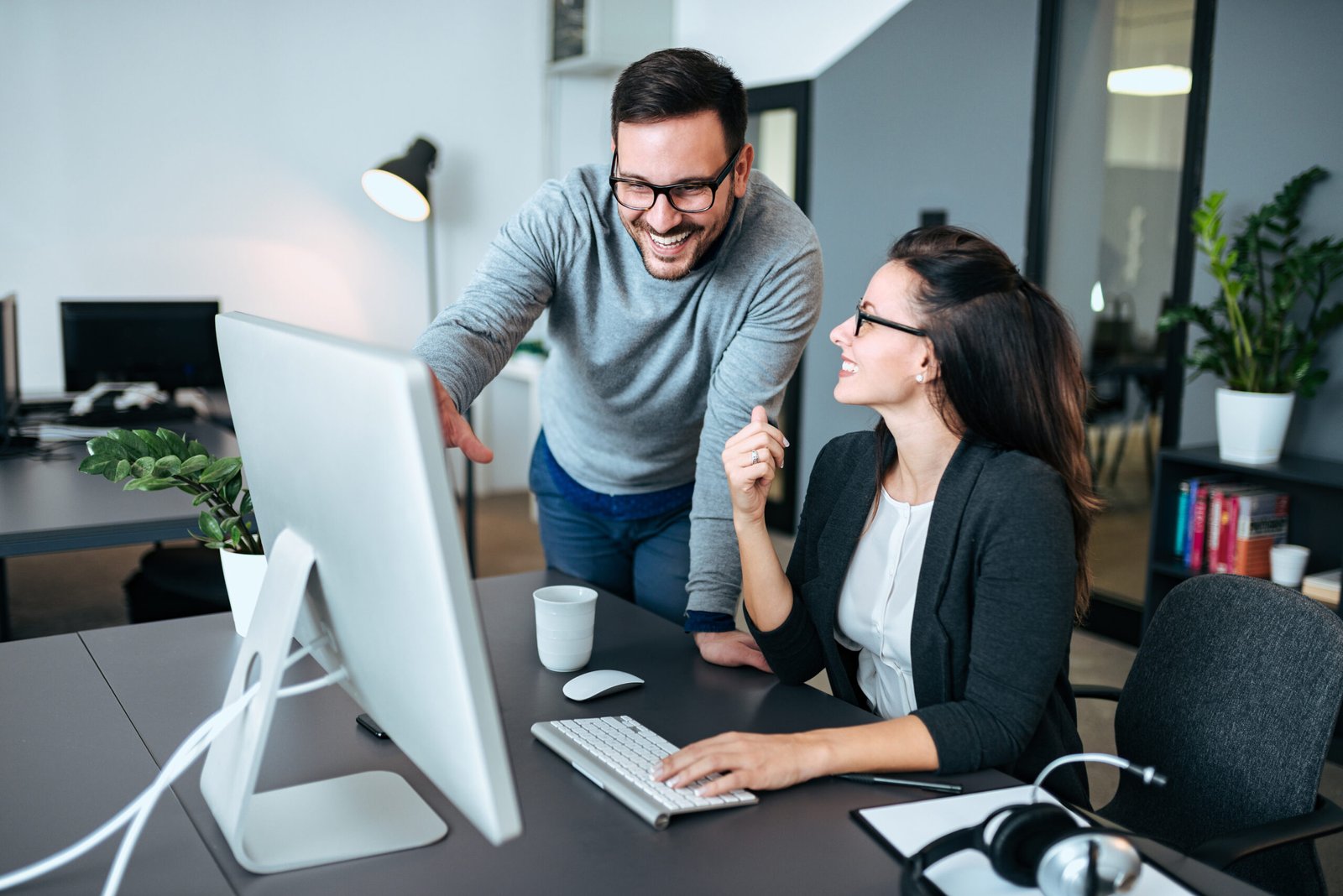 Two young business people meeting and discussing business.